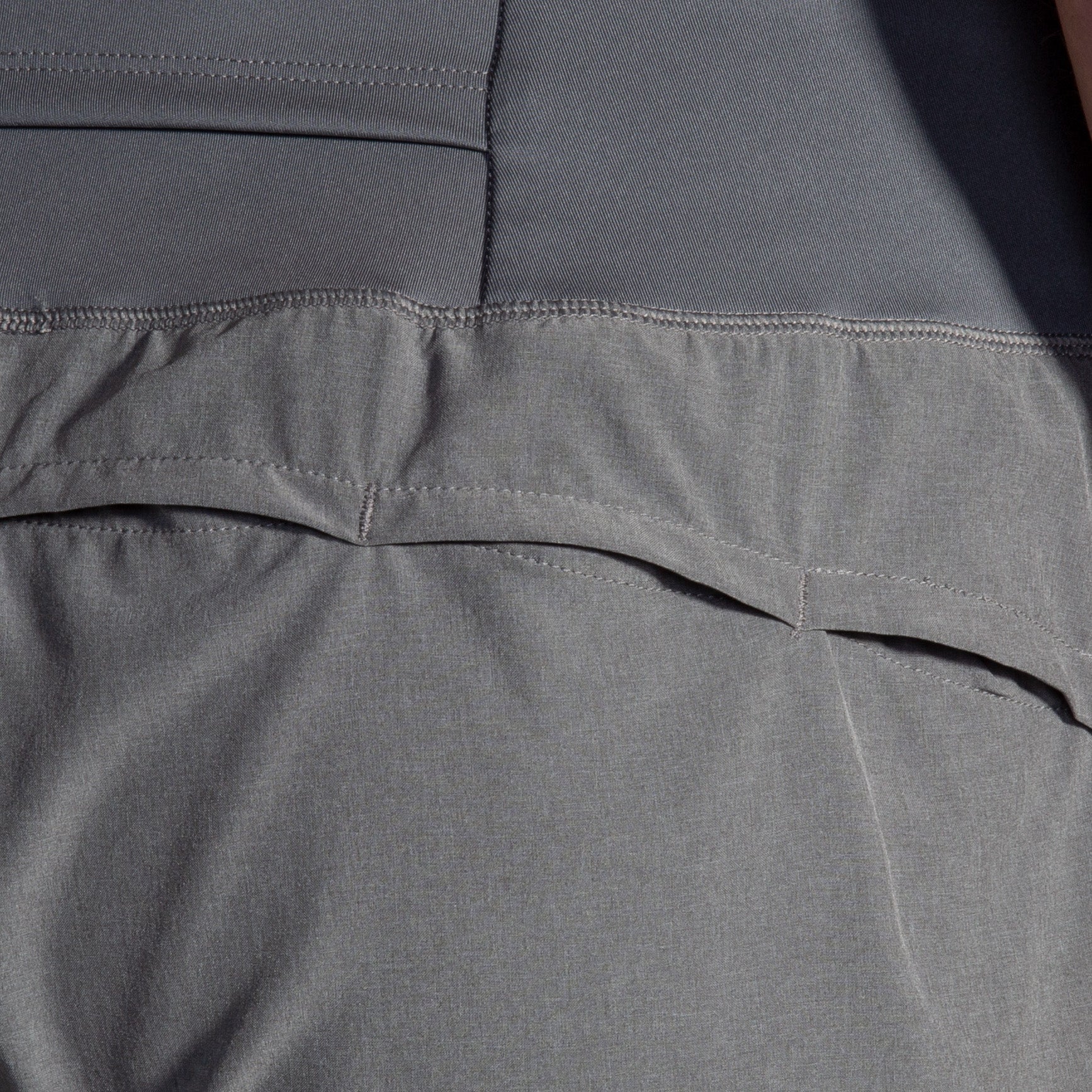 Brooks Chaser 7-inch Women's Short in HTR Charcoal, close-up back detail view