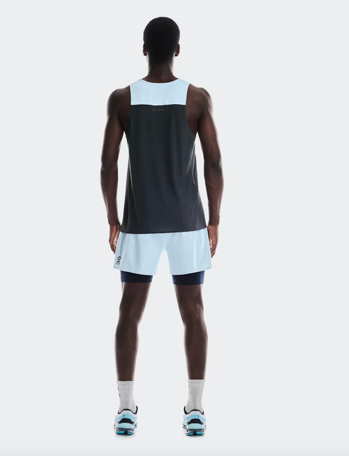Back view of man wearing On Performance Tank in arctic and eclipse colorblock design