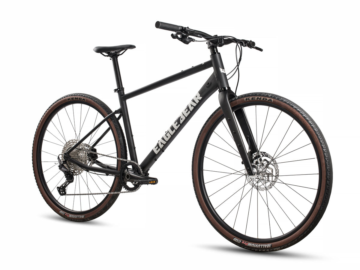 Eagle Bicycles Eagle 700 Hybrid black bike with tan sidewall tires, three-quarter front angle view