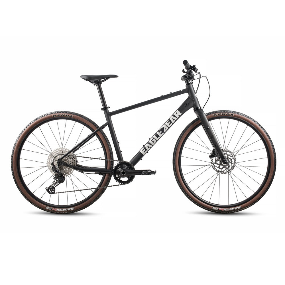Eagle Bicycles Eagle 700 Hybrid in matte black with brown sidewall Kenda tires, side profile view