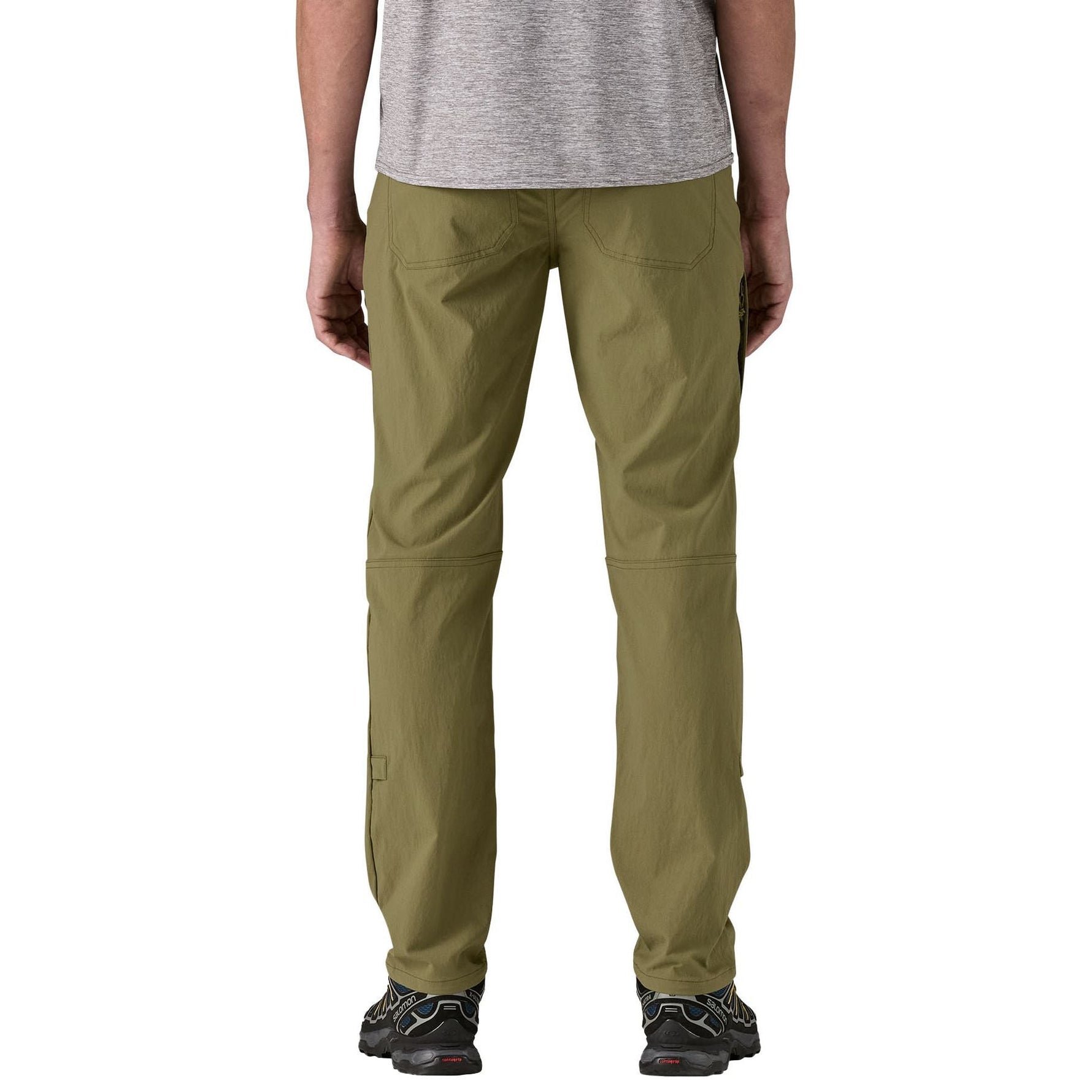 Patagonia men's Quandary pants in olive green on model from back view