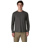 Male model wearing Patagonia Long-Sleeved Capilene Cool Trail Shirt in Ink Black, front view