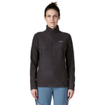 Front close-up of woman modeling black Patagonia R1 Air Fleece Zip-Neck with zigzag texture