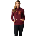 Woman wearing Fox Racing burgundy pullover hoodie with orange fox logo