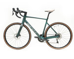 Scott Addict 20 road bike in teal green with drop handlebars and disc brakes