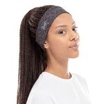 Woman wearing Buff Cool Net UV+ headband in Reflective Graphite color
