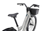 Specialized Turbo Como SL electric bike in brushed silver with front basket
