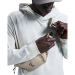 Person wearing On Waist Pack 2L Lite in sand color across chest