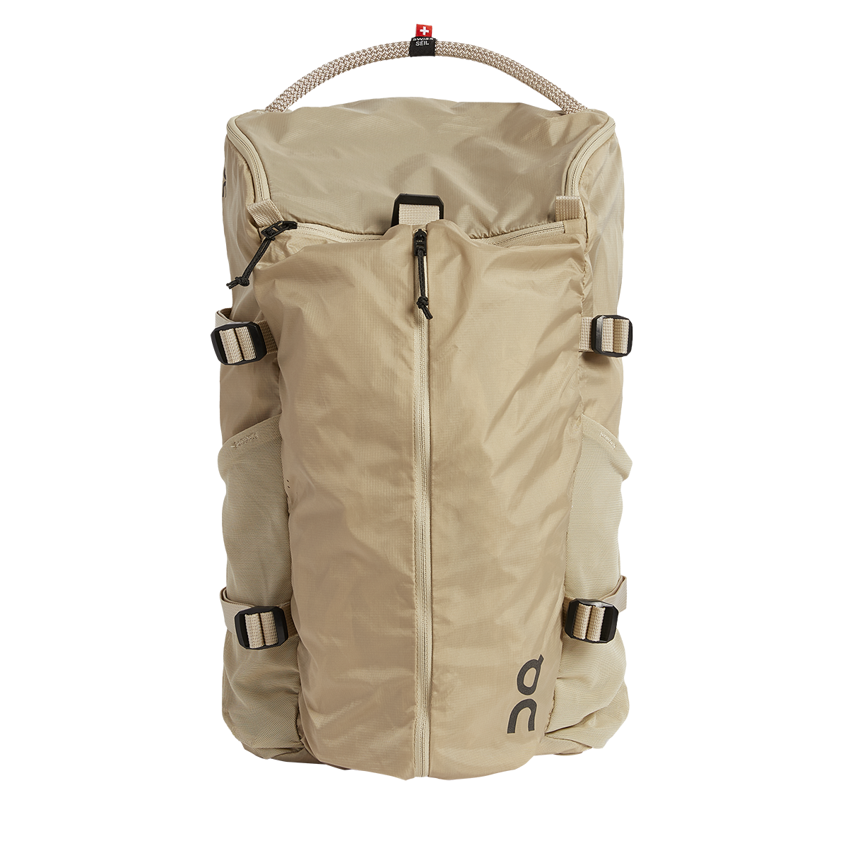 On Speed Pack 18L Lite backpack in cream sand color with rope handle and compression straps