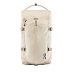 On Speed Pack 18L Lite backpack in cream with rope handle and buckle straps