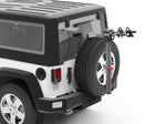 Yakima SpareRide bike rack mounted on Jeep spare tire with professional studio background