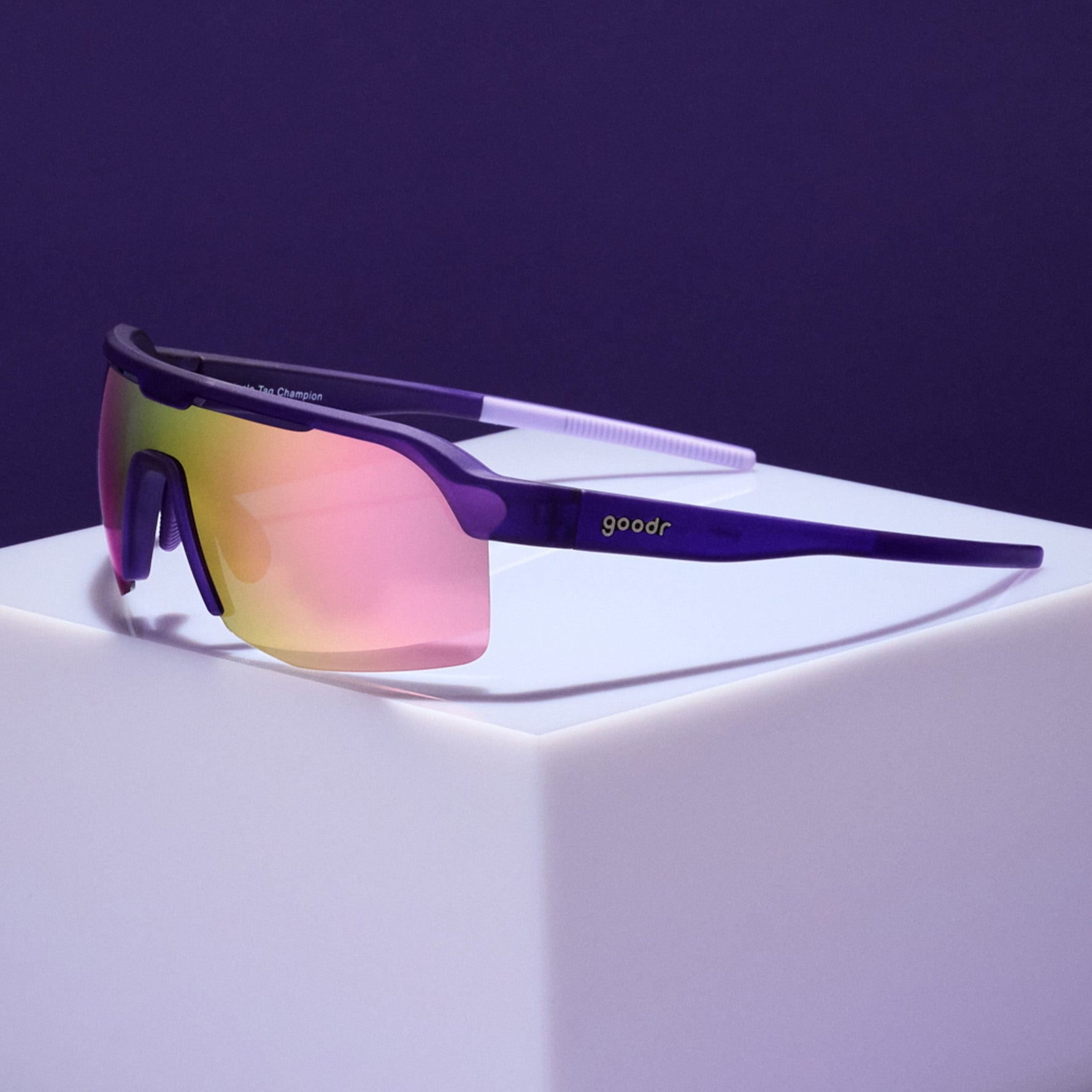 Goodr Tentacle Tag Champion sunglasses with purple frame and gradient mirrored lenses