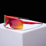 Goodr red sports sunglasses with orange gradient mirrored lenses on white surface