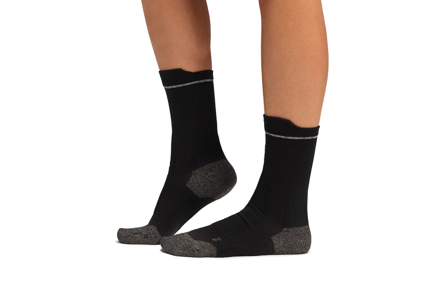 Black On Merino Ultra socks with gray heel and toe details on model legs