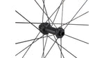 Close-up of bicycle wheel hub with black spokes against white background
