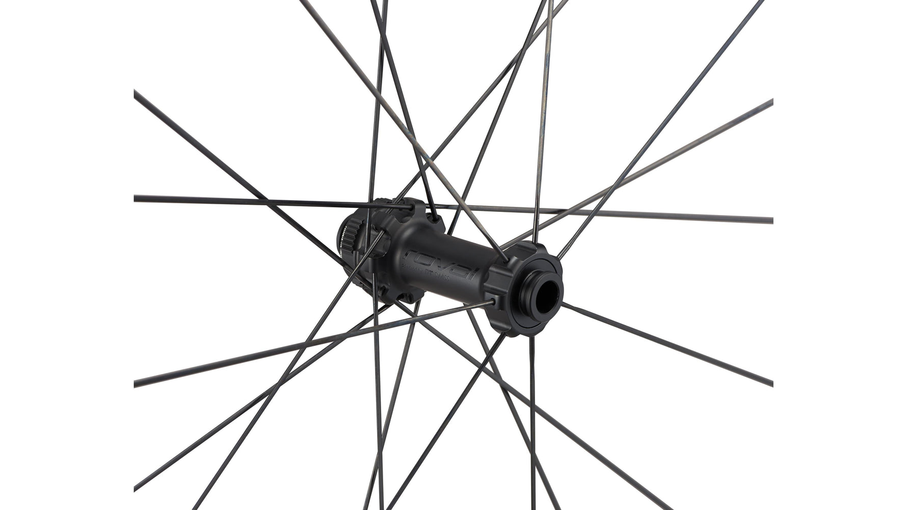 Close-up of bicycle wheel hub with black spokes against white background