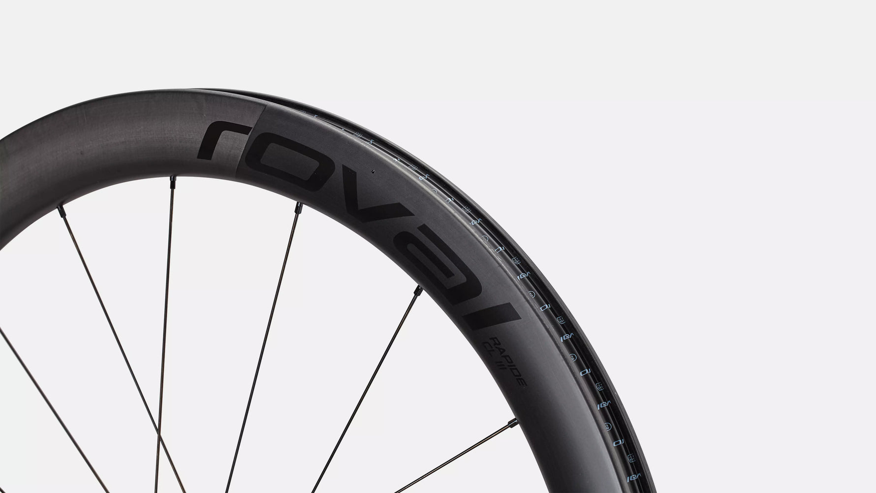 Specialized Roval bicycle wheel with dark carbon rim and black spokes