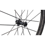 Specialized Roval carbon bicycle wheel showing hub and spokes on white background