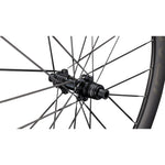 Specialized Roval bicycle wheel hub with black carbon finish and spokes