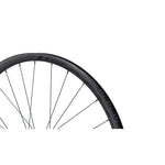 Specialized Roval Control SL V carbon bicycle wheel with black spokes on white background