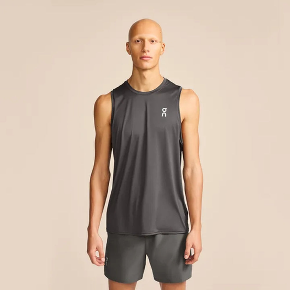 Man wearing On Core Tank in dark gray sleeveless athletic shirt