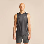 Man wearing On Core Tank in dark gray sleeveless athletic shirt