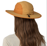 Back view of woman wearing orange and tan Patagonia Quandary Brimmer hat with long brown hair