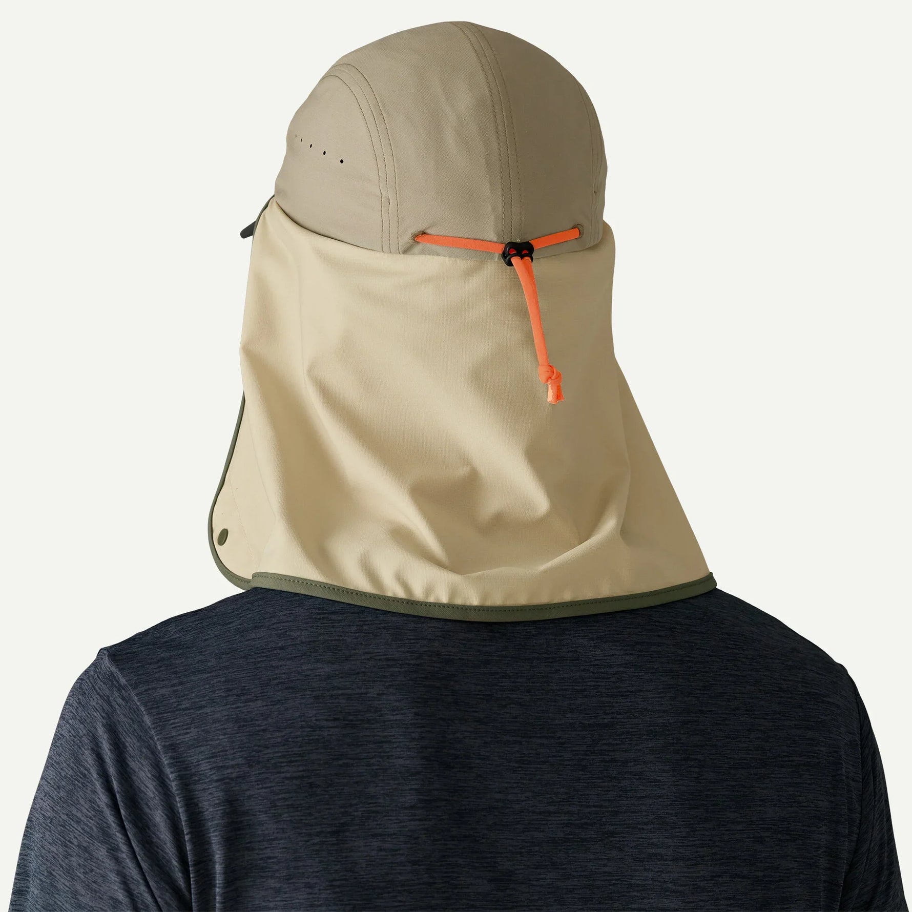 Patagonia Caped Merganzer Hat in tan color with neck cape and orange adjustment cord
