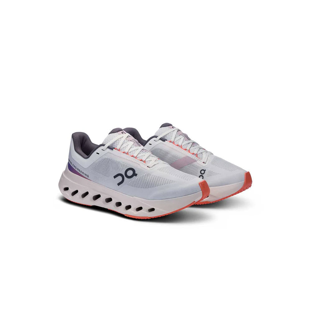 On Cloudsurfer Next running shoes in white and flame colorway with distinctive sole holes