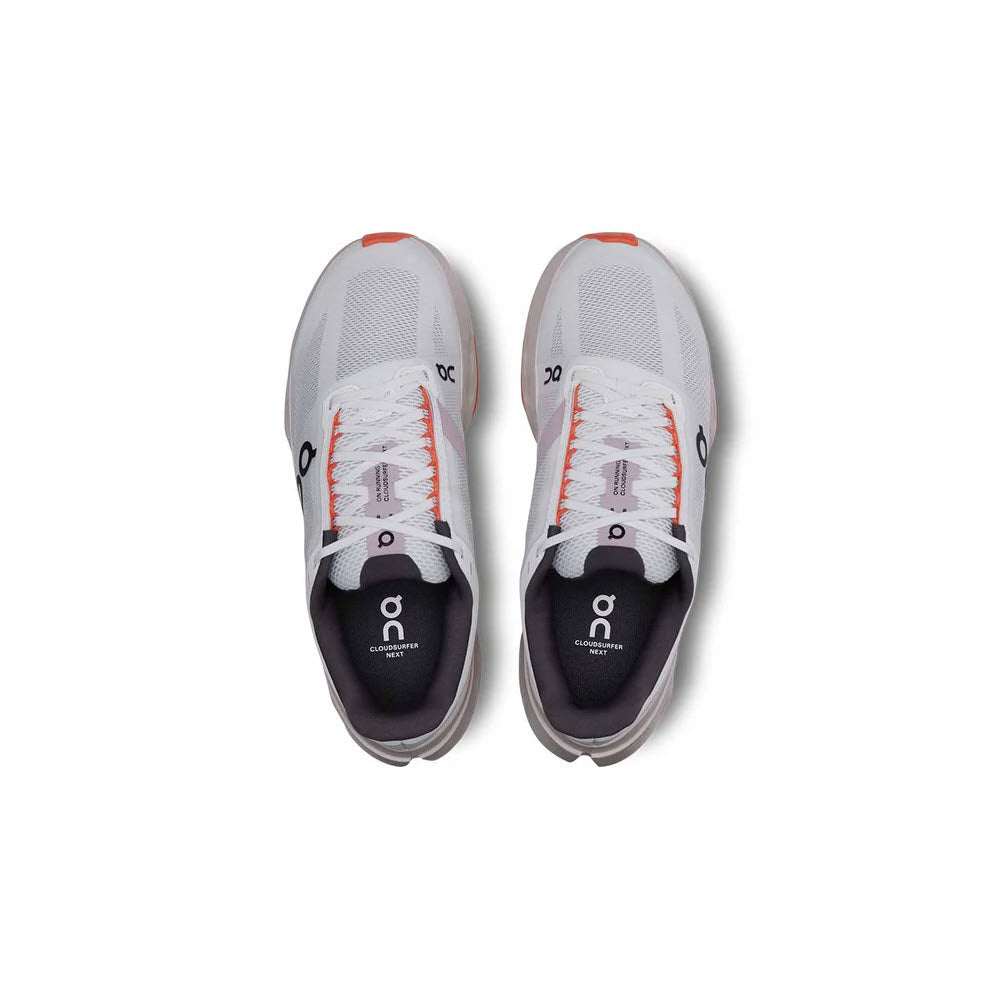 On Cloudsurfer Next women's running shoes in white with flame orange accents, top view