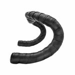 Black bicycle handlebar tape with geometric textured pattern arranged in curved S-shape