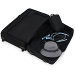 Dakine 365 Roller 100L black suitcase opened showing interior compartments with travel accessories