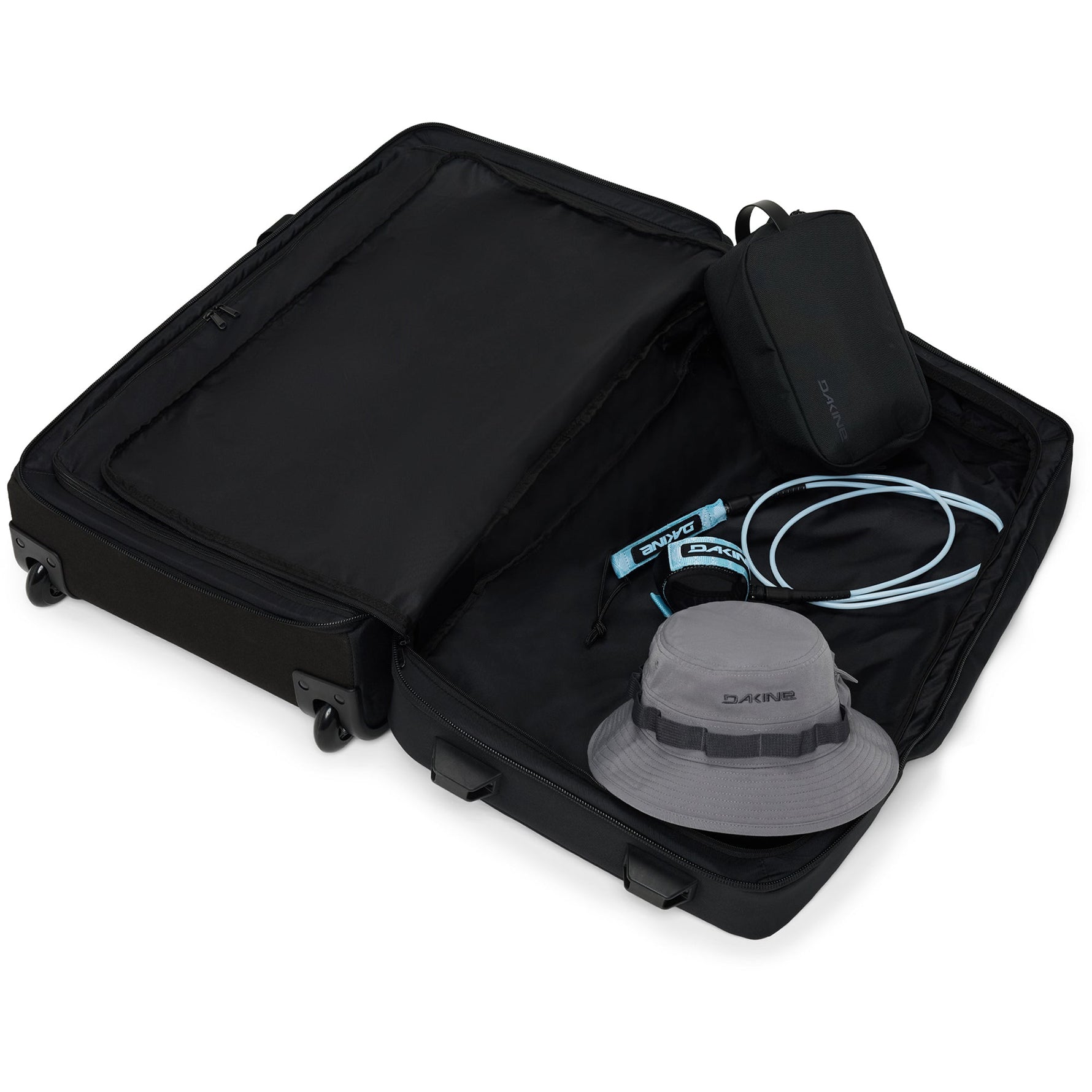 Dakine 365 Roller 100L black suitcase opened showing interior compartments with travel accessories