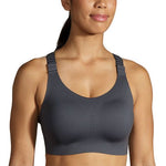 Woman wearing Brooks Dare Racerback 2.0 sports bra in asphalt gray color