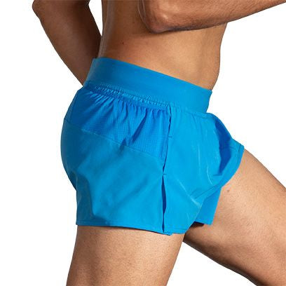 Brooks Sherpa 3-inch Split Running Short in bright cyan Spring Break color on male model
