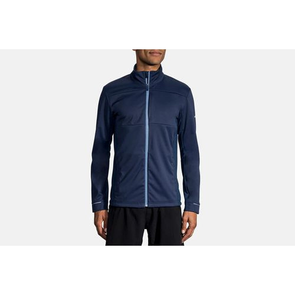 Brooks Volt Jacket in navy blue worn by male model on clean background