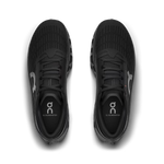 On Cloudmonster running shoes in black with silver logo branding