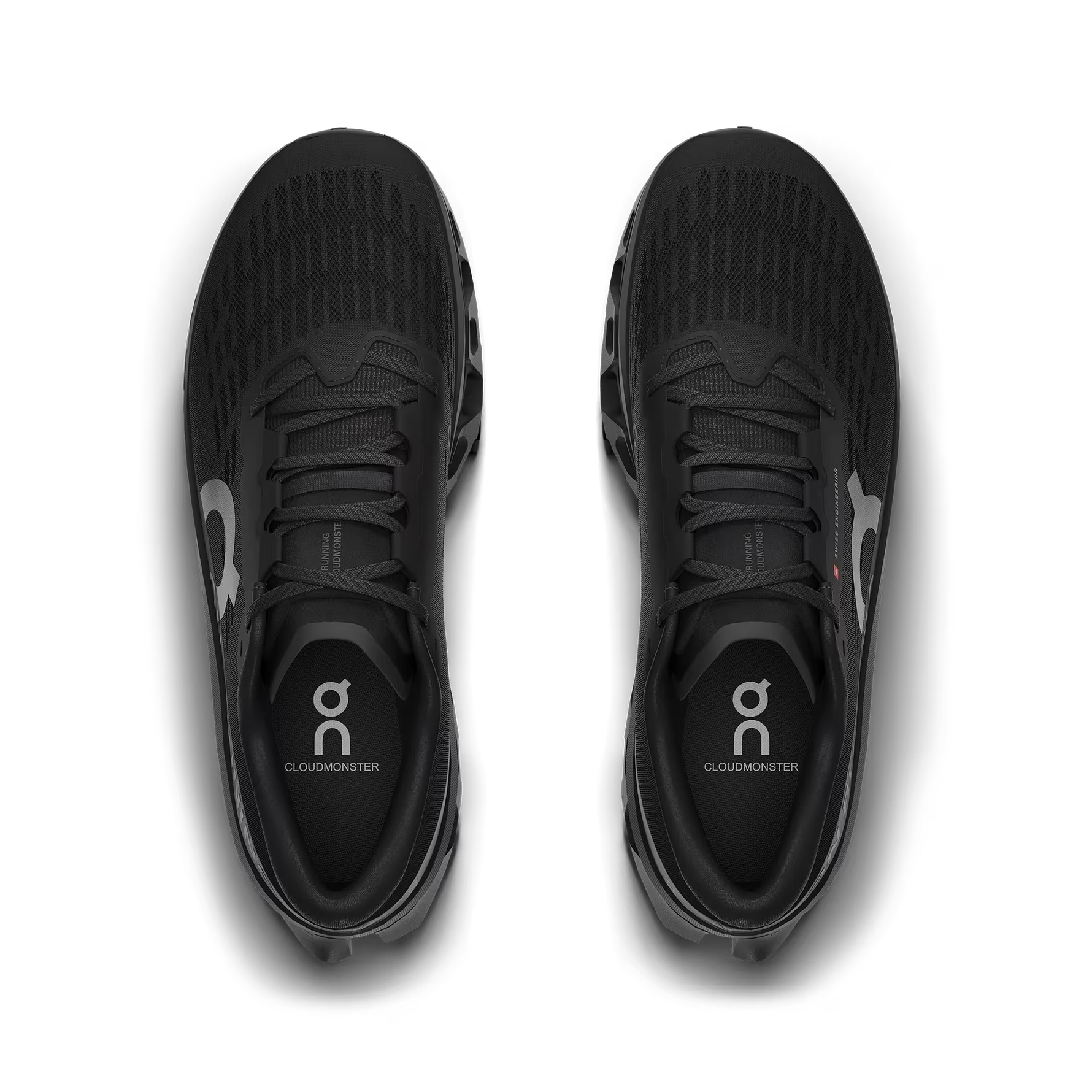 On Cloudmonster running shoes in black with silver logo branding
