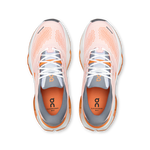 On Cloudrunner Max pair of running shoes top-down view showing pink mesh upper and orange insole