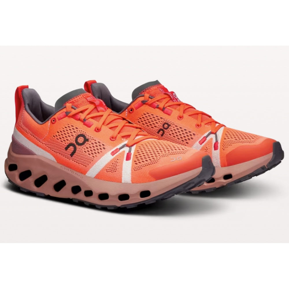 On Cloudsurfer women's trail running shoes in flame orange and dustrose pink colorway