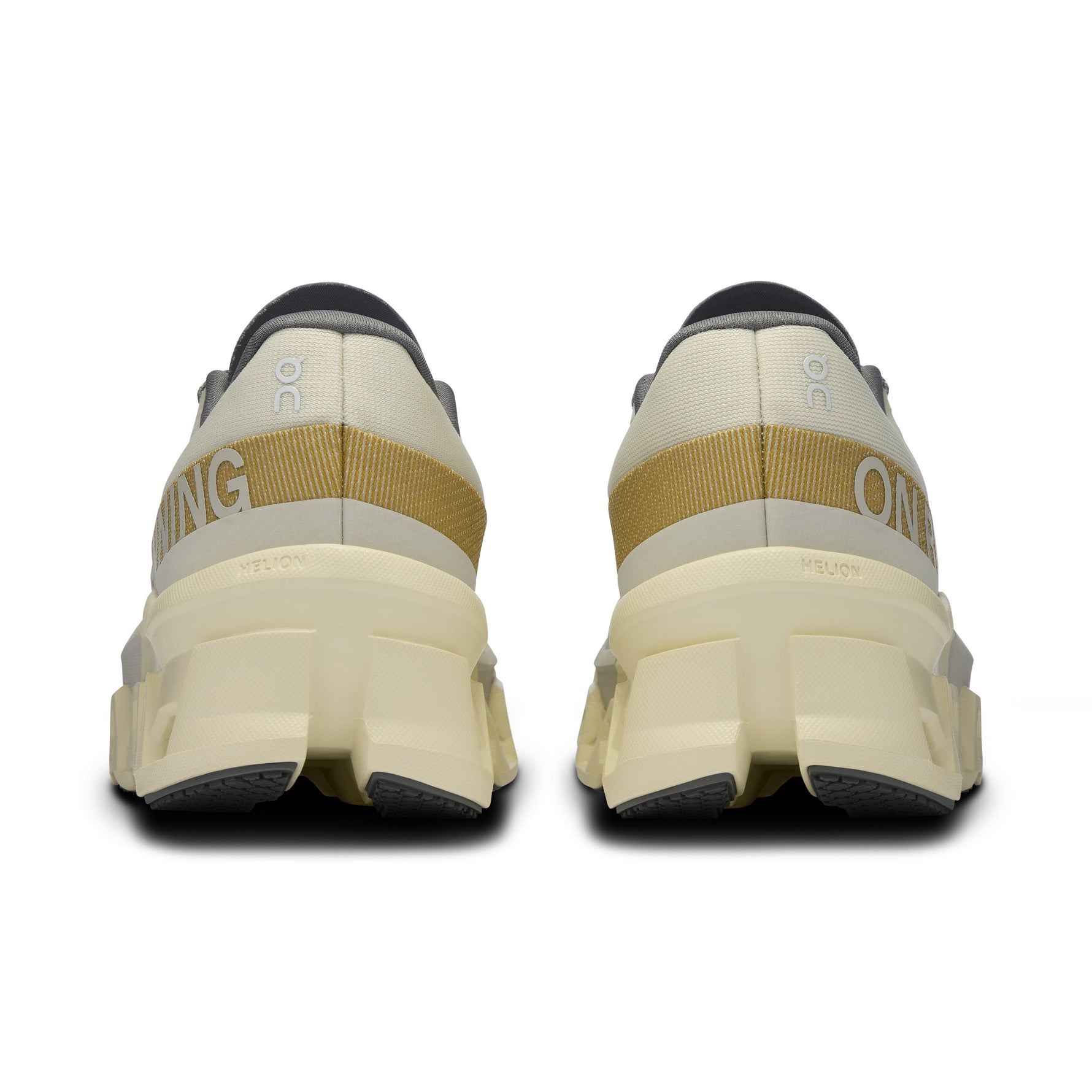 On Cloudmonster 2 running shoes in cream colorway, rear view showing chunky sole