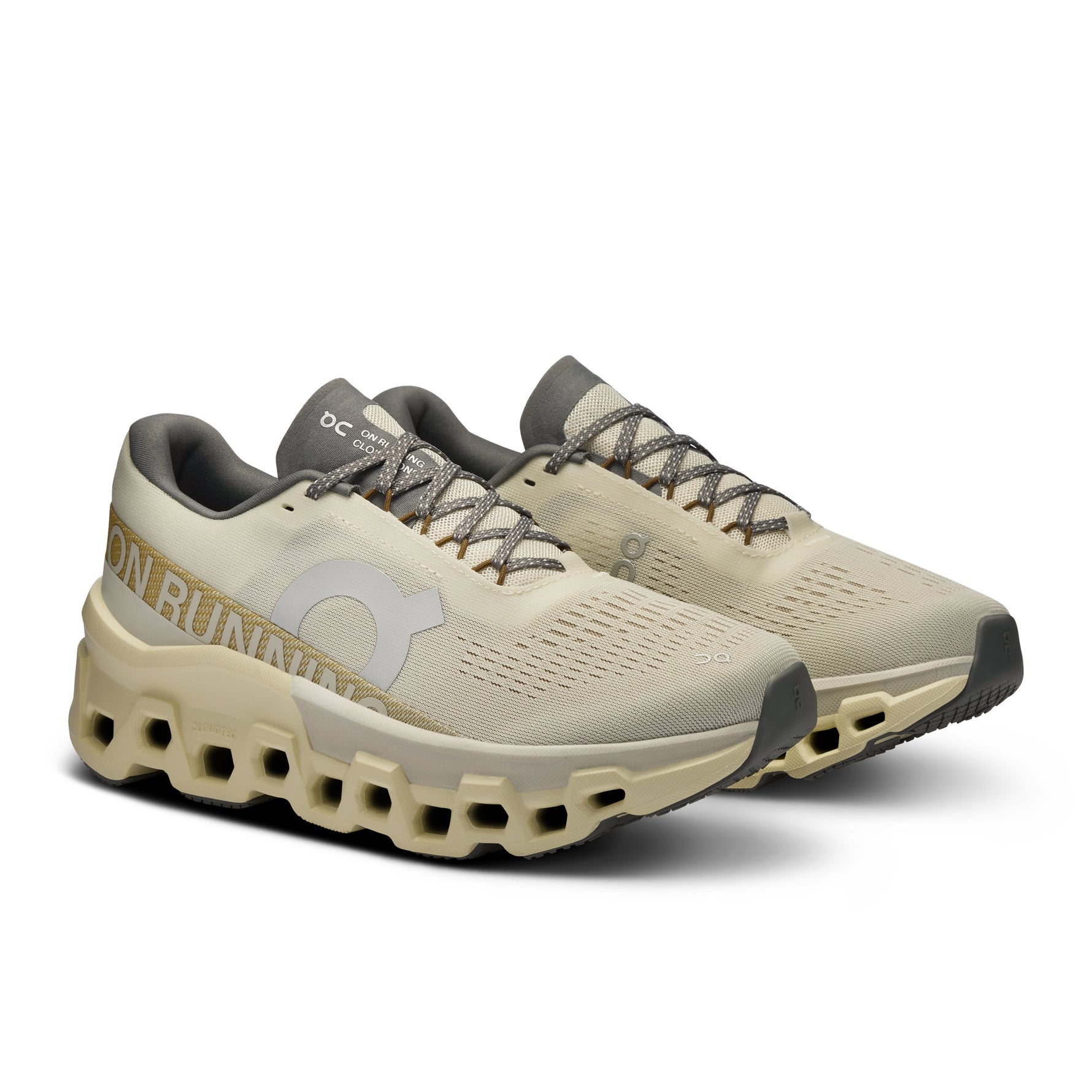 On Cloudmonster 2 running shoes in cream colorway with distinctive cloud sole