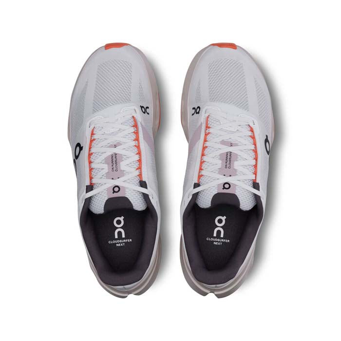 On Cloudsurfer women's running shoes in white with orange flame accents, top view