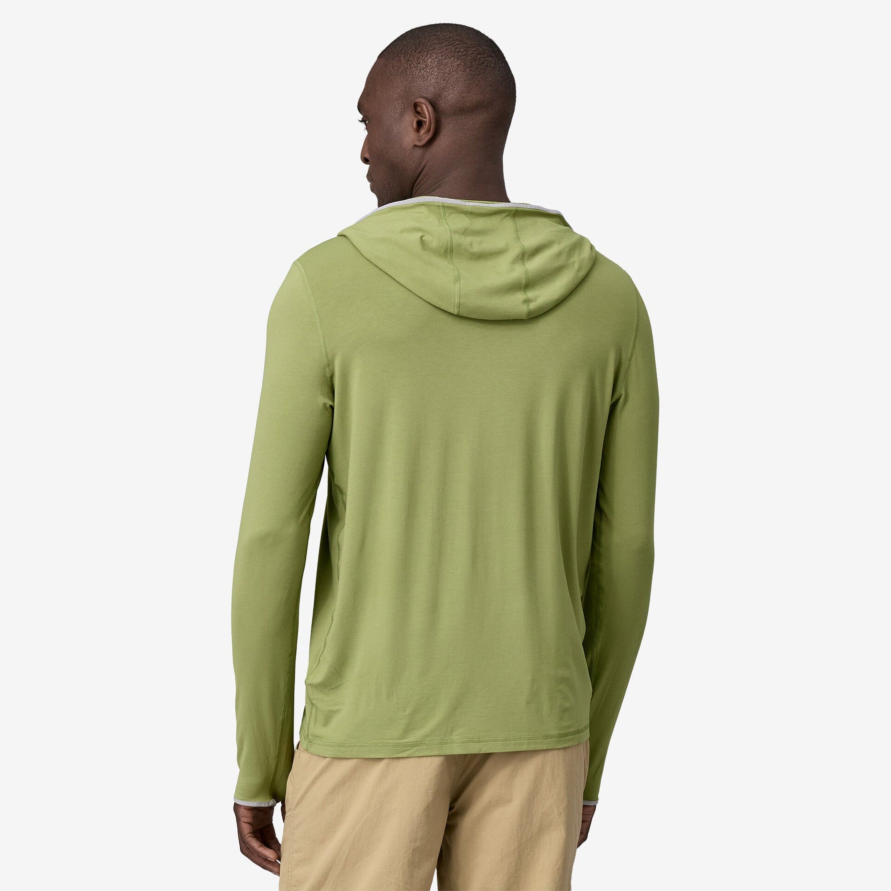 Back view of man wearing Patagonia green hooded long-sleeve shirt