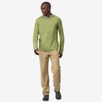 Man wearing Patagonia Tropic Comfort hooded long sleeve shirt in wispy green