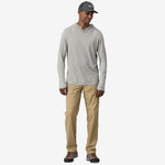 Man wearing Patagonia gray-green hooded long sleeve shirt with khaki pants