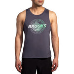 Man wearing Brooks Distance Tank 2.0 in asphalt gray with green trail graphic