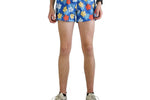 ChicknLegs men's blue shorts with colorful hibiscus flower pattern on model