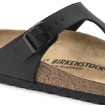 Black Birkenstock Gizeh thong sandal with buckled toe strap on cork footbed