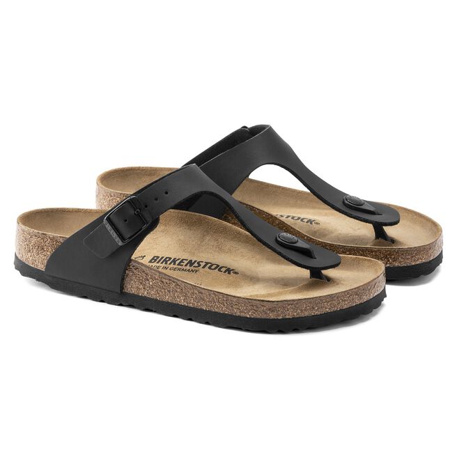Black Birkenstock Gizeh thong sandals with cork footbed on white background